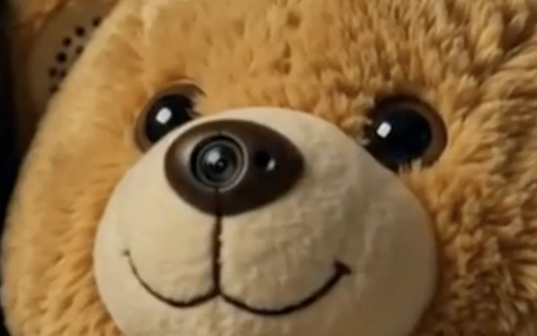 The bear's face. The camera lens sits open inside its nose.
